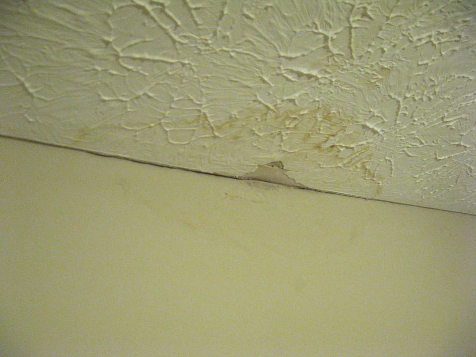 Water staining across an interior ceiling