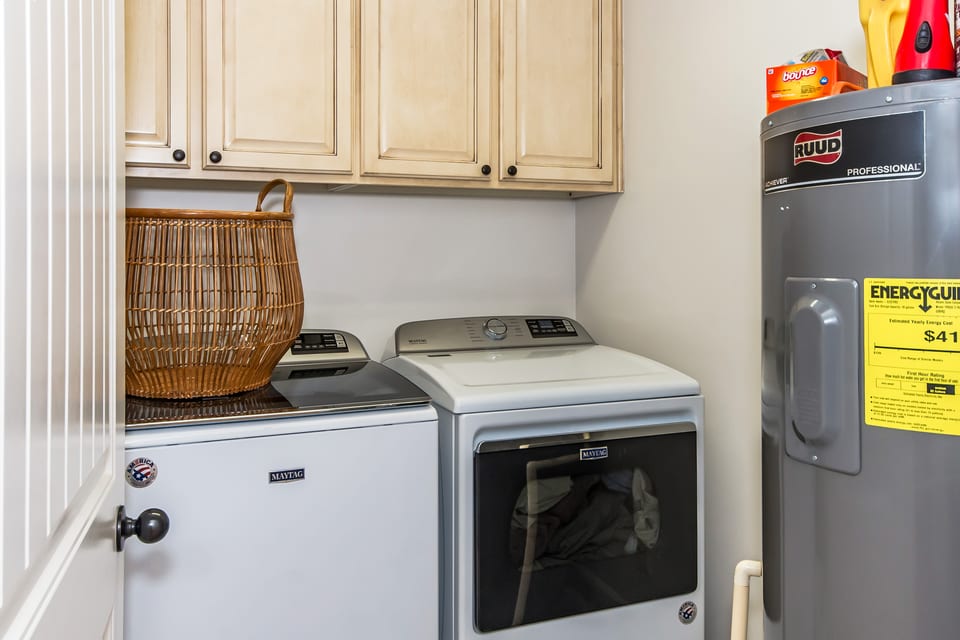 Residential laundry room with washer, dryer and water heater